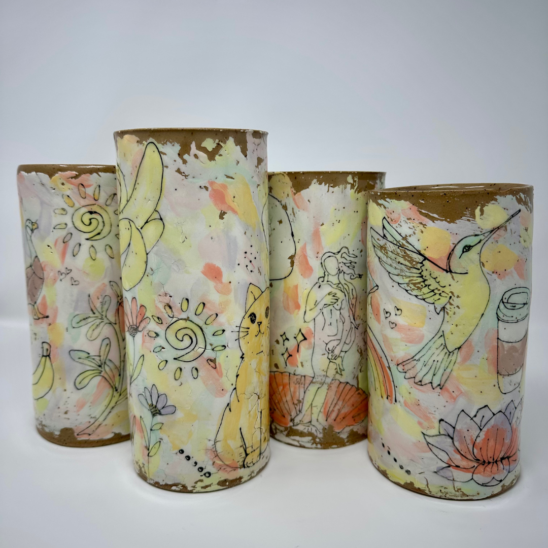 Colorful handmade ceramic vases on a white background